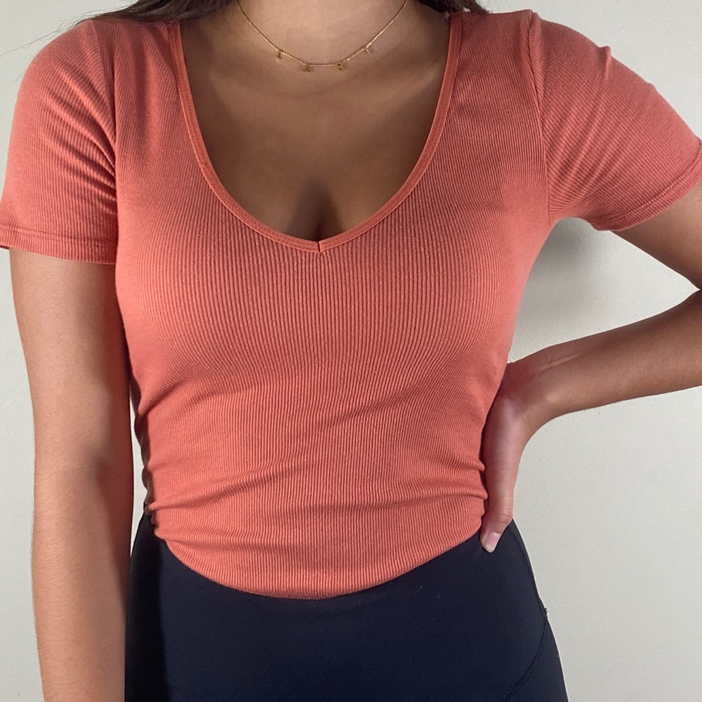 Heart & hips Bodysuit V-neck salmon color.
